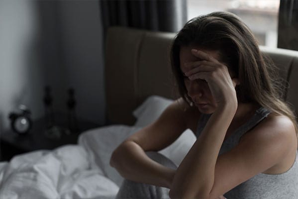 A young woman with heroin withdrawal symptoms