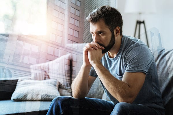 A young man thinking about his prescription drug addiction