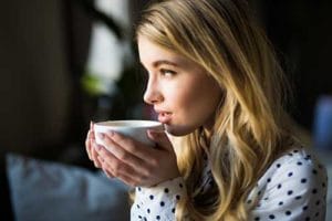 a woman drinking tea to calm down at an anxiety treatment center