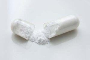 pill with white powder spilling out, PCP detox center Jacksonville, FL