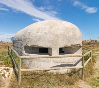a concrete bunker in a field