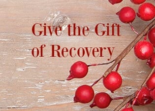 give the gift of recovery holiday image with holly berries