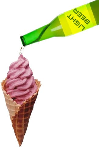 an ice cream cone with beer being poured over the top