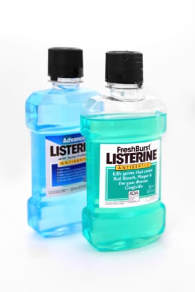 two bottles of Listerine on white backdrop