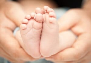 a closeup of the bottoms of a babys feet small