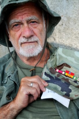 older male veteran in military fatigues illustrating the connection between stress and addiction