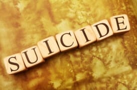 the word suicide spelled out in game tiles