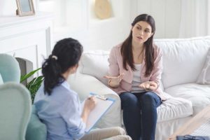 therapist discusses signs of ecstasy use with patient at addiction treatment center